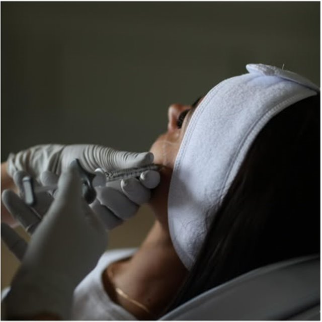 Skin treatment being carried out in the treatment chair at a Putney clinic in London SW15